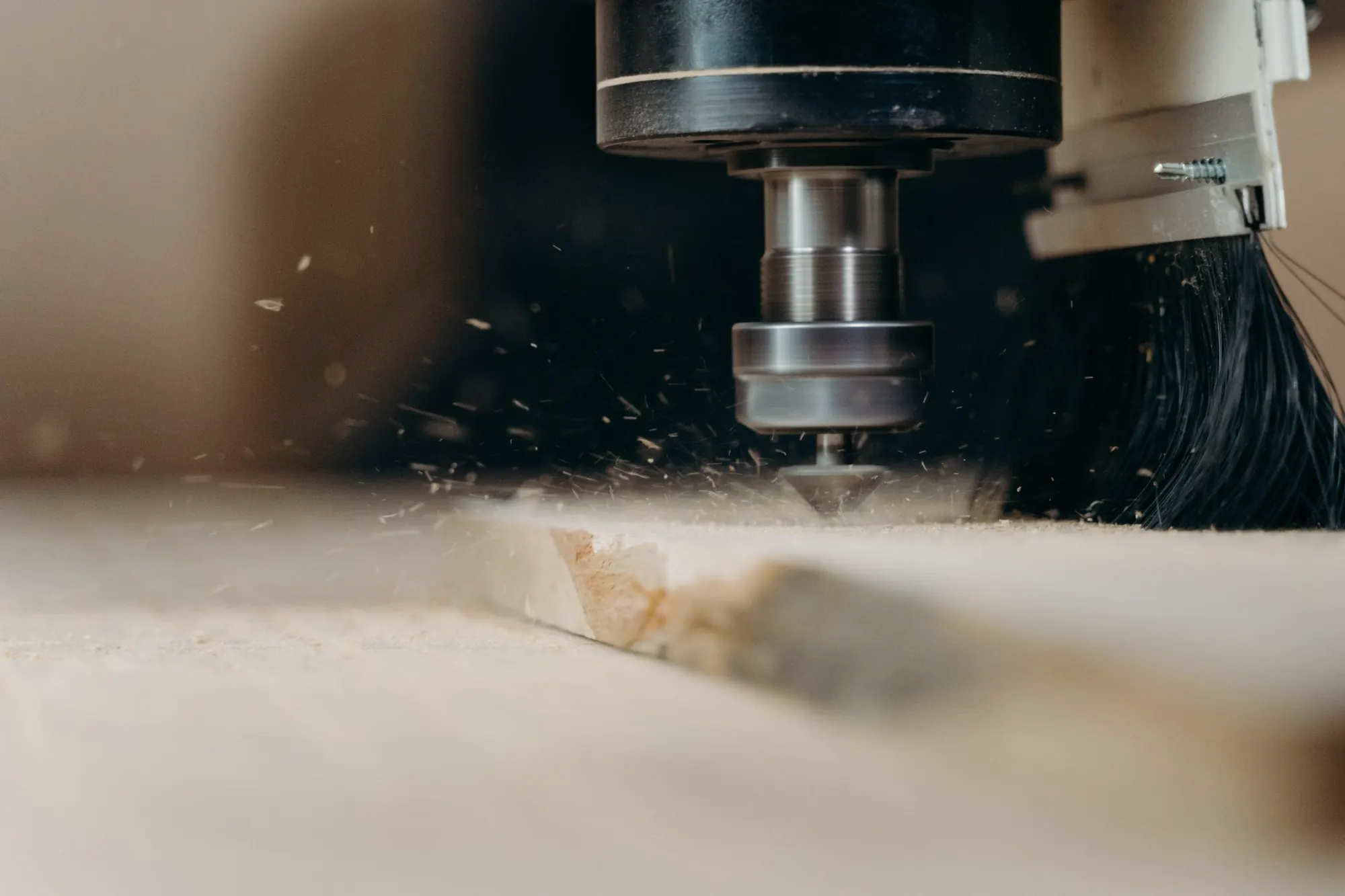 CNC router cutting a wooden panel