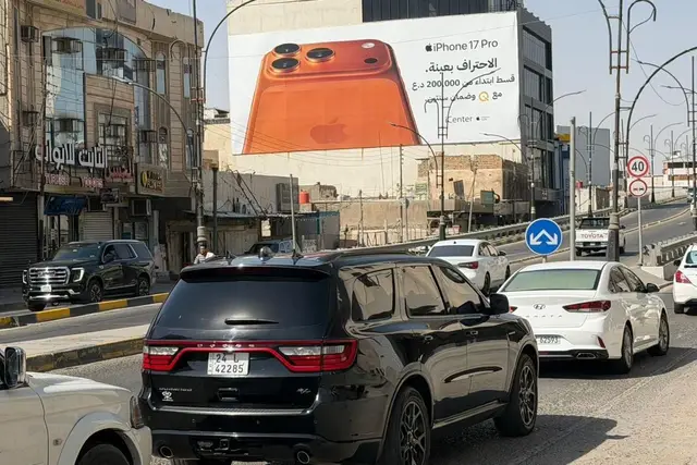 Apple/iPhone billboard at Al Jazair -14 Tamooz Street, Basra