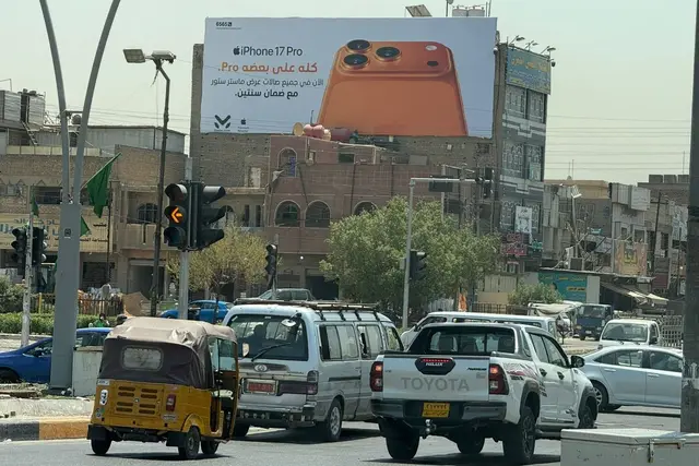 Apple/iPhone billboard at Al Sadir City – 55 Intersection, Baghdad