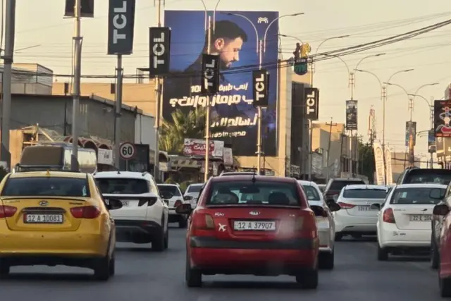 Billboard at Al Zuhoor – Al Halawany Sweet Street, Nineveh